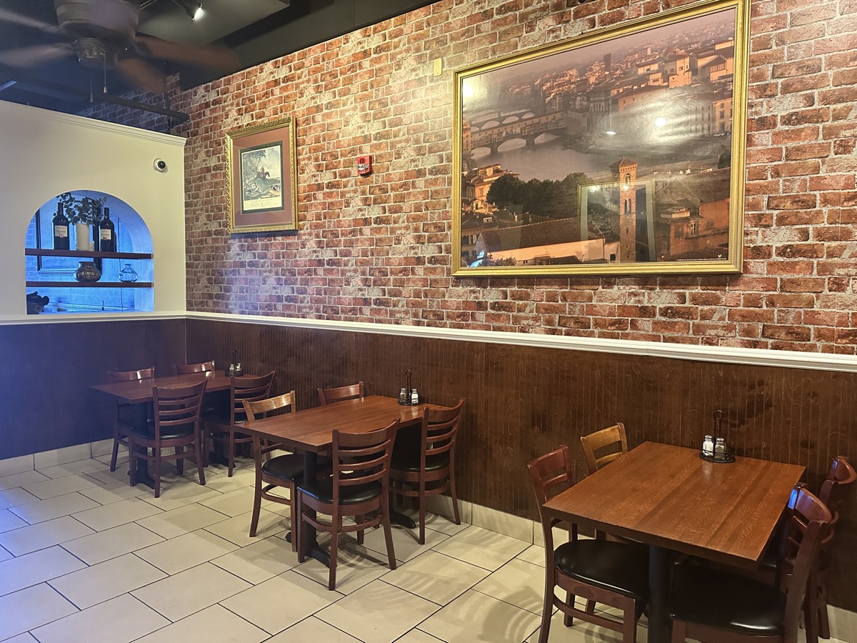 Cozy Italian dining area at Capriccio restaurant Myrtle Beach with coastal paintings